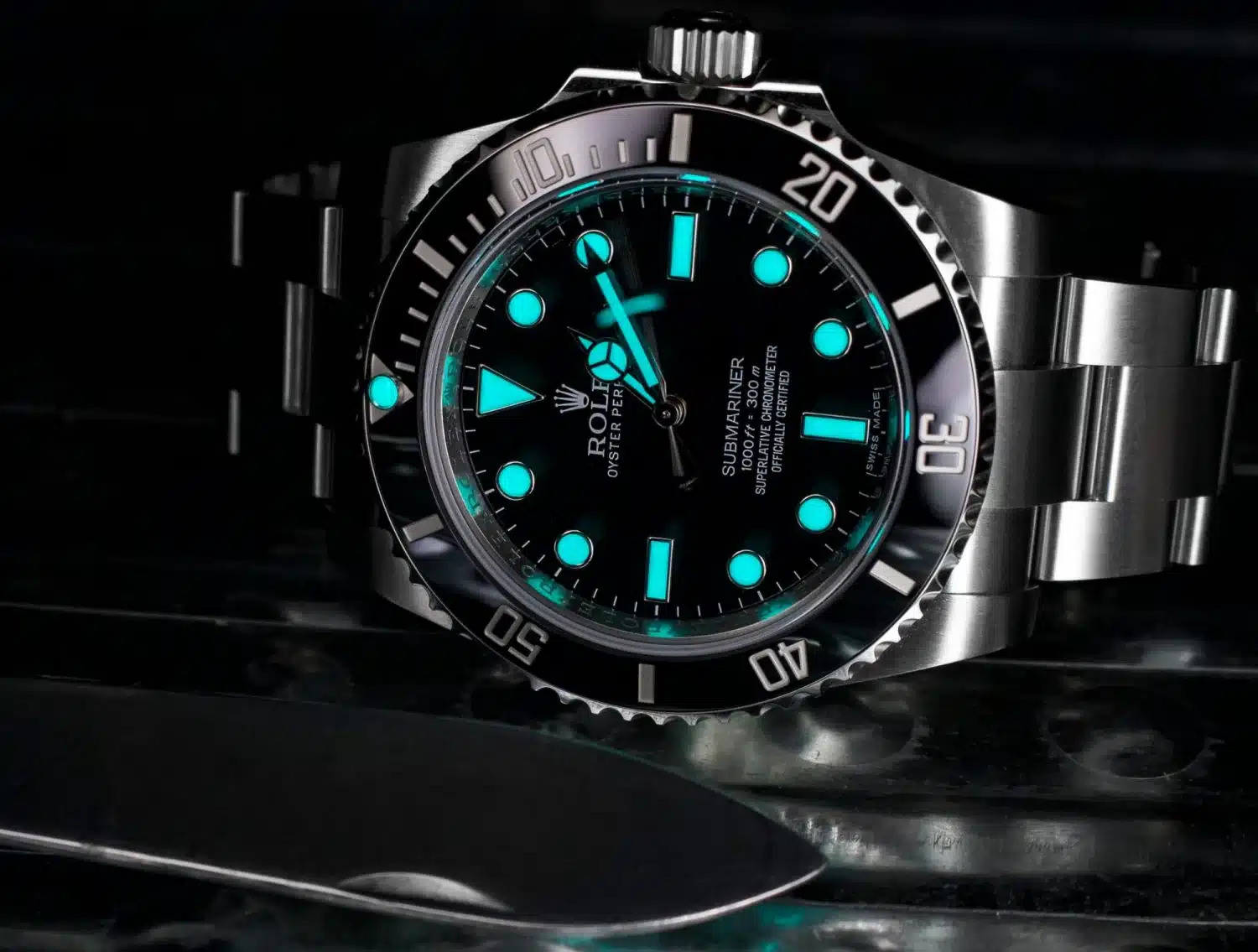 Rolex super clone watch displaying Chromalight ice-blue luminescence in the dark