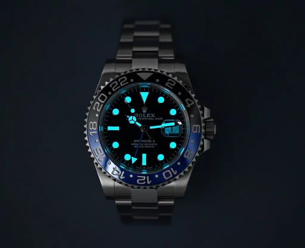 Macro detail of ice-blue Chromalight lume on a Rolex Batman GMT-Master II M126710BLNR super clone dial